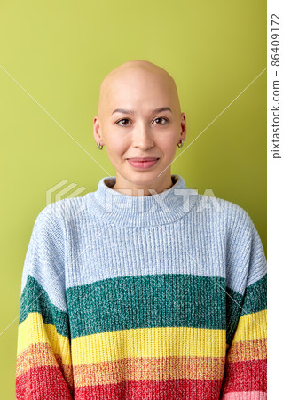 Portrait of positive smiling bald female in casual wear posing looking at camera 86409172