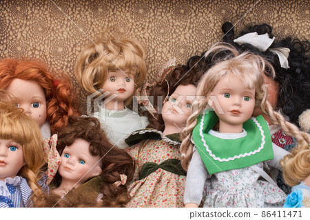 Close-up of retro and vintage dolls. Handmade toy. Close-up of retro and vintage dolls. Handmade toy. 86411471