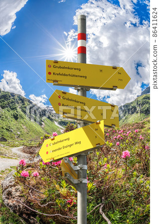 Signpost against spring Alps, Zell am See-Kaprun region, Austria Signpost against spring Alps, Zell am See-Kaprun region, Austria 86411624