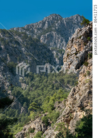 mountain landscape, limestone wooded rocks of the Taurus range 86411715