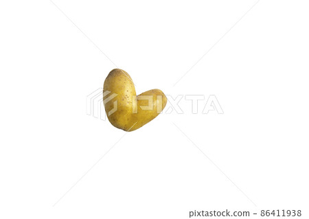 Raw potatoes in the shape of a heart on a white background Raw potatoes in the shape of a heart on a white background 86411938