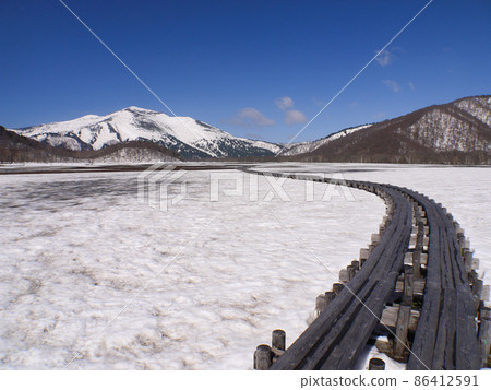 Ozegahara covered with spring Oze and remaining snow Ozegahara covered with spring Oze and remaining snow 86412591