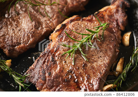 Steak sautéed in a frying pan Steak sautéed in a frying pan 86412806