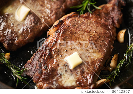 Steak sautéed in a frying pan Steak sautéed in a frying pan 86412807