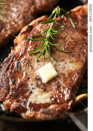 Steak sautéed in a frying pan Steak sautéed in a frying pan 86412808