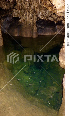 Blue underground lake in a limestone cave Blue underground lake in a limestone cave 86413902