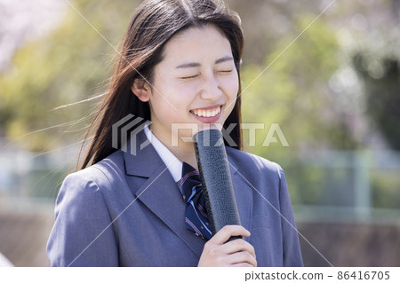 High school girl graduation image that pleases with a diploma High school girl graduation image that pleases with a diploma 86416705