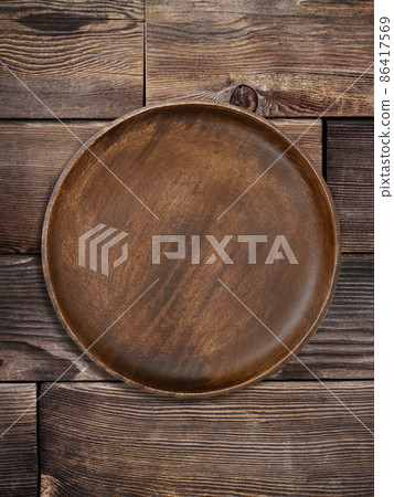 Plate placed on a wooden table 86417569