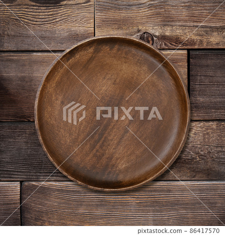 Plate placed on a wooden table 86417570