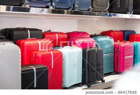 Image with travel suitcases on shelves in a store Image with travel suitcases on shelves in a store 86417688