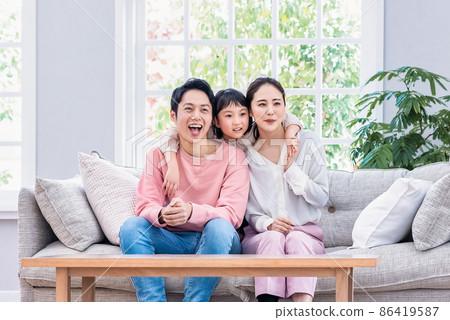 Family unity dad, mom and elementary school children 86419587