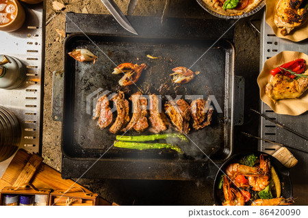 Rib steak grilled pork rib steak at an outdoor Rib steak grilled pork rib steak at an outdoor 86420090