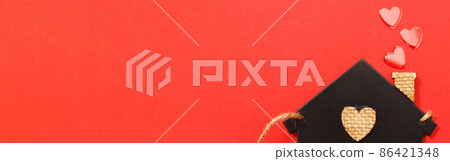 small toy house with red hearts from pipe on red background. Concept of love , family 86421348