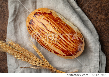 Bun with cheese filling on napkin Bun with cheese filling on napkin 86421986
