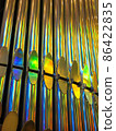 Closeup picture of the pipes of church organ with the rainbow play of colors. 86422835