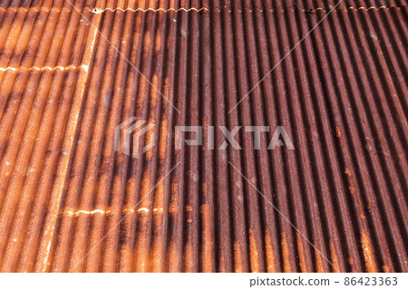 Background photo of a rusty red metal roof slope Background photo of a rusty red metal roof slope 86423363