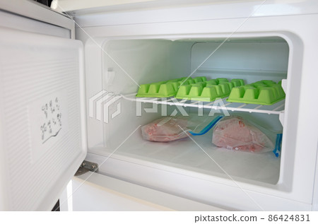 Raw minced meat of  beef in plastic bags in the freezer 86424831