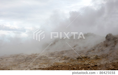 Steaming fumarole in geothermal area of Hverir, Iceland 86425038