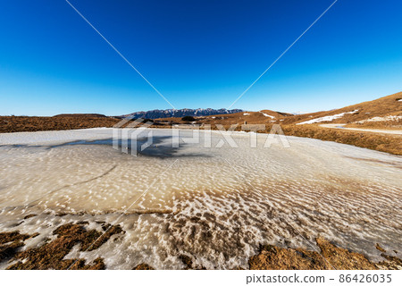 Lessinia Plateau in Winter and Mountain Range of Monte Baldo - Italian Alps 86426035