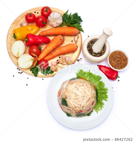 Delicious chicken aspic on a plate isolated on white background Delicious chicken aspic on a plate isolated on white background 86427262