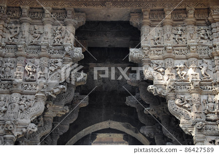Carved idols on the Vadodara Bhagol also known as the Western gate, located in Dabhoi, Gujarat, India 86427589