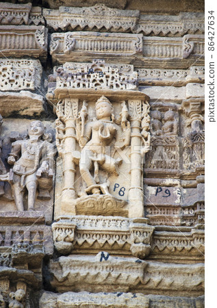 Carved Hira Bhagol, the Eastern gate named after it's architect; Hiradhar, located in Dabhoi, Gujarat, India 86427634
