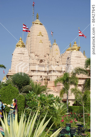 Nilkanthdham, Swaminarayan temple an extensive religious complex with pagodas, fountains, statues & carved idols and gates, located at Poicha, Gujarat, India 86427645