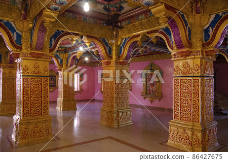 Interior of the temple at Nilkanthdham, Swaminarayan temple an extensive religious complex with pagodas, fountains, statues & carved idols and gates, located at Poicha, Gujarat, India 86427675
