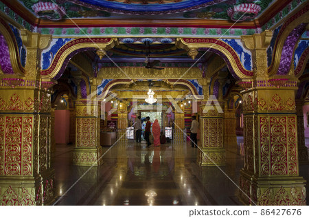 Interior of the temple at Nilkanthdham, Swaminarayan temple an extensive religious complex with pagodas, fountains, statues & carved idols and gates, located at Poicha, Gujarat, India Interior of the temple at Nilkanthdham, Swaminarayan temple an extensive religious complex with pagodas, fountains, statues & carved idols and gates, located at Poicha, Gujarat, India 86427676