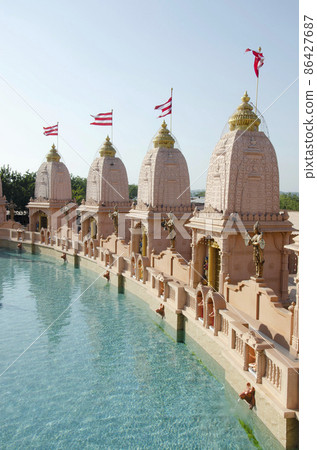 Sandstone mandapas around the artificial lake at Neelkanth Dham Swaminarayan Temple, Poicha, Gujarat, India, located at Poicha, Gujarat, India Sandstone mandapas around the artificial lake at Neelkanth Dham Swaminarayan Temple, Poicha, Gujarat, India, located at Poicha, Gujarat, India 86427687