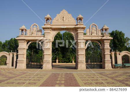 Carved Gateway at Nilkanthdham, Swaminarayan temple Poicha, Gujarat, India 86427699