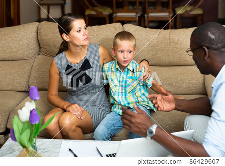 Woman meeting with African American agent Woman meeting with African American agent 86429607