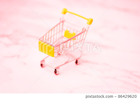 shopping cart. Copy space for text or design. Stainless steel shopping trolley upside down. Minimalist shopping concept. shopping cart. Copy space for text or design. Stainless steel shopping trolley upside down. Minimalist shopping concept. 86429620