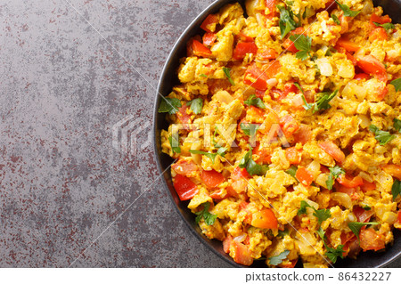 Perfect Egg Bhurji Spiced Indian Scrambled Eggs closeup in the plate. Horizontal top view 86432227