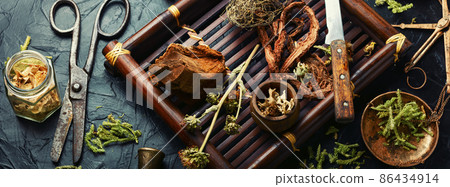 Tray with healing herbs. 86434914