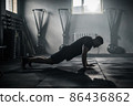 Sportsman Do Exercises at Big Dark Gym . 86436862