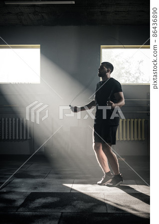Sportive Man Has Cardio Workout With Skipping Rope . 86436890
