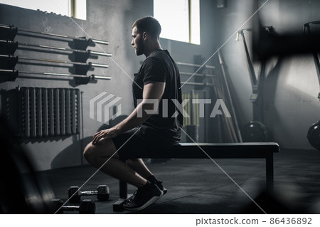 Sportsman Take Pause After Workout With Dumbbells . 86436892