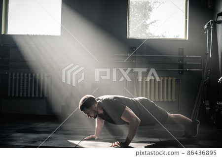 Man Do Push Ups in Gym . 86436895