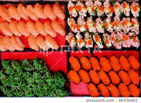 Full frame of colorful Japanese food sushi nigiri set trays top view angle 86436902