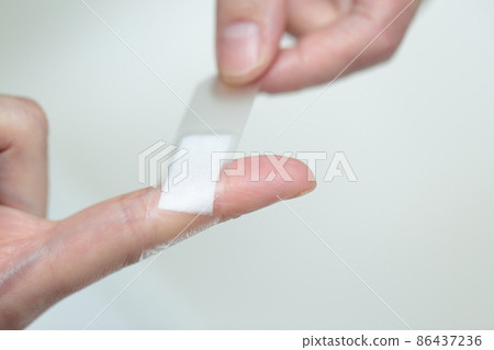 Female finger sticking plaster 86437236