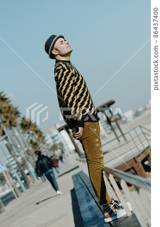 modern middle-aged man standing outdoors modern middle-aged man standing outdoors 86437400