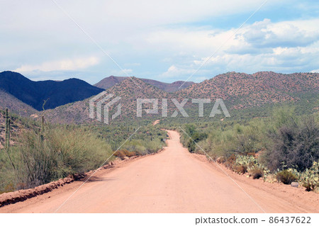 The unpaved red sandy street The unpaved red sandy street 86437622