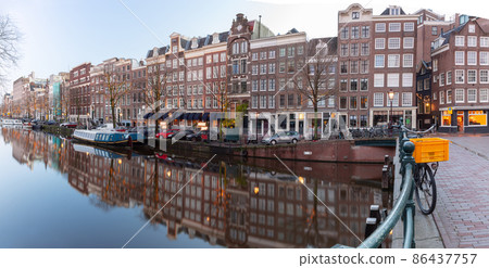Panorama of the city embankment of Amsterdam at dawn. Panorama of the city embankment of Amsterdam at dawn. 86437757