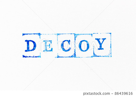 Blue color ink rubber stamp in word decoy on white paper background 86439616