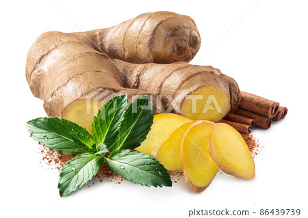 Giner root next to pile of cinnamon sticks,  mint leaves and ground cinnamon isolated Giner root next to pile of cinnamon sticks,  mint leaves and ground cinnamon isolated 86439739