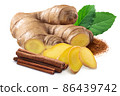 Giner root next to pile of cinnamon sticks, rama tulsi leaves and  ground cinnamon isolated 86439742