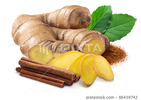 Giner root next to pile of cinnamon sticks, rama tulsi leaves and ground cinnamon isolated Giner root next to pile of cinnamon sticks, rama tulsi leaves and ground cinnamon isolated 86439742