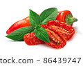 Dried or Sundried tomato halves with chile  pepper and basil isolated 86439747