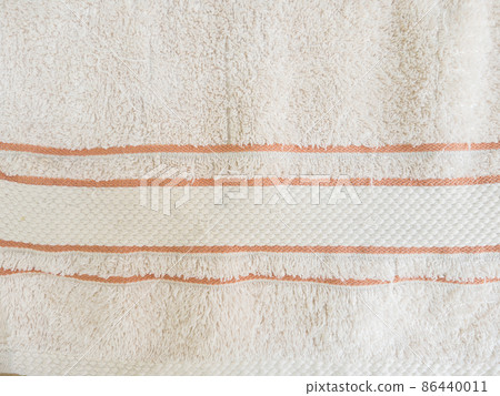 The detail of the soft cotton towel with the striped pattern. 86440011